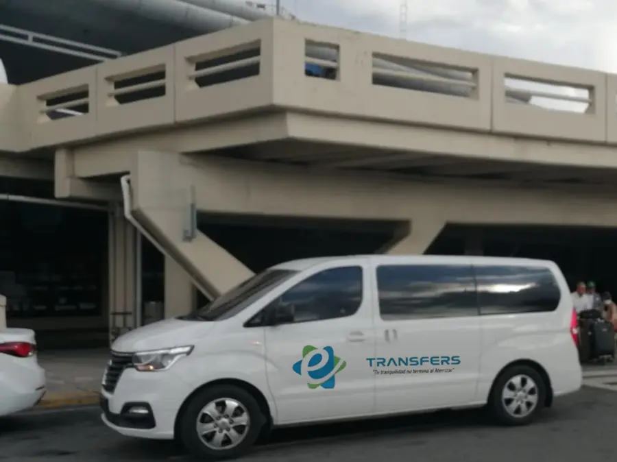 White minivan outside the arrivals terminal